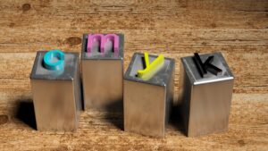 Quattro caratteri tipografici metallici che compongono la sigla CMYK, i colori base della stampa in quadricromia usata in tipografia.